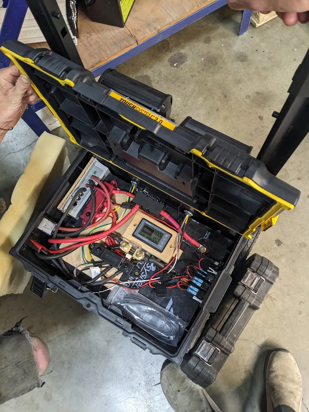 Portable power pack built into a rugged ToughSystem tool case with battery, monitor display, and fuse block wired together