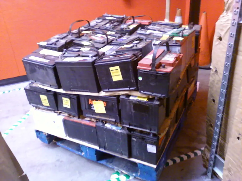 Pallet of scrap lead-acid batteries ready for recycling