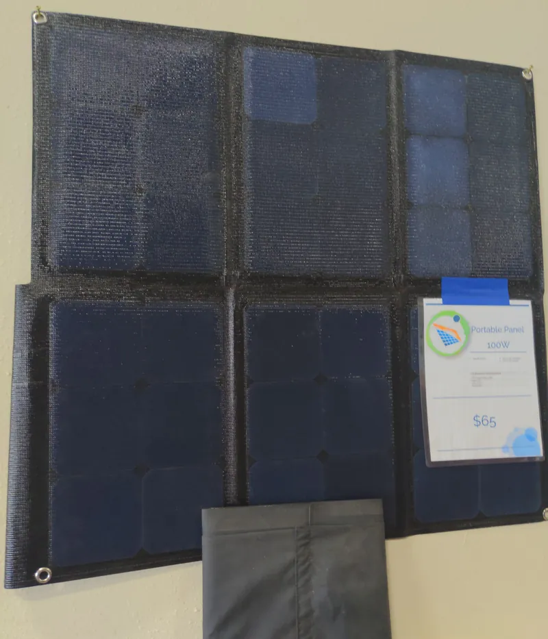 100W portable folding solar panel unfolded, with its carry case